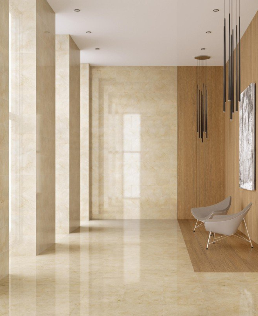 Bright and modern hallway featuring Crema Marfil Marble flooring and columns – refined architectural elegance by Natural Stone Spain.
