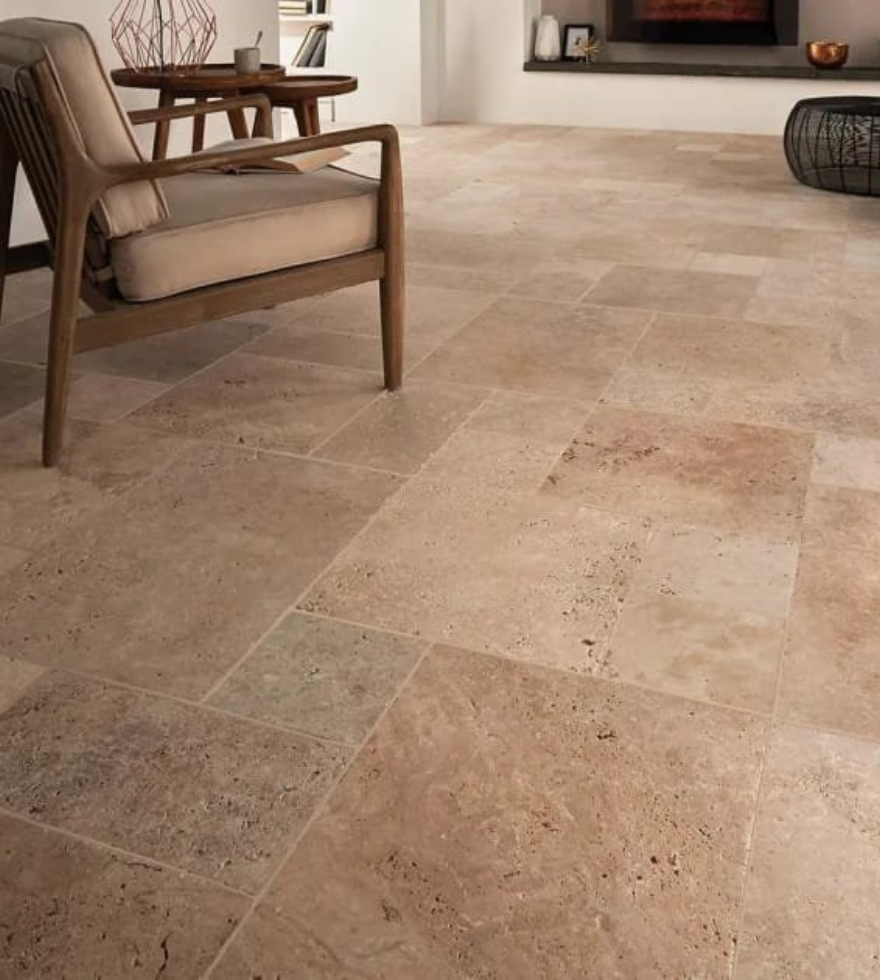 Cozy living space with rustic Classic Travertine flooring – natural earth tones and textured finish by Natural Stone Spain