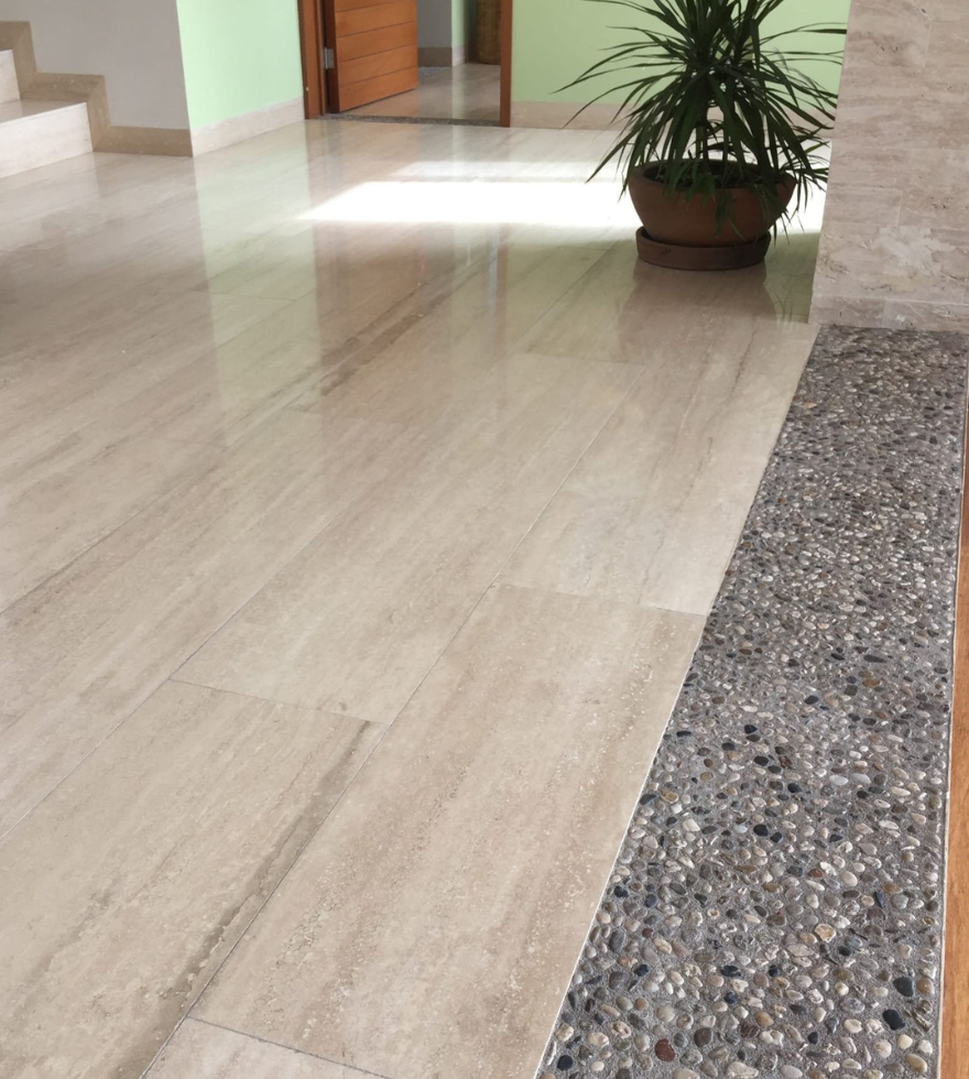 Polished Classic Travertine marble flooring in a bright indoor space – elegant and durable finish by Natural Stone Spain.