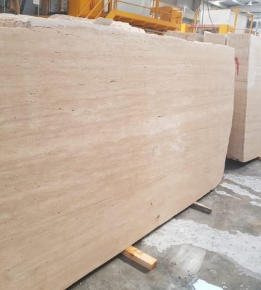 Large raw slab of Classic Travertine marble ready for fabrication – premium natural stone sourced by Natural Stone Spain.