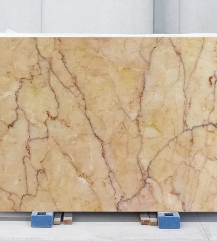 Polished slab of Crema Valencia Marble showcasing beige background with soft veining – ready for export from Natural Stone Spain