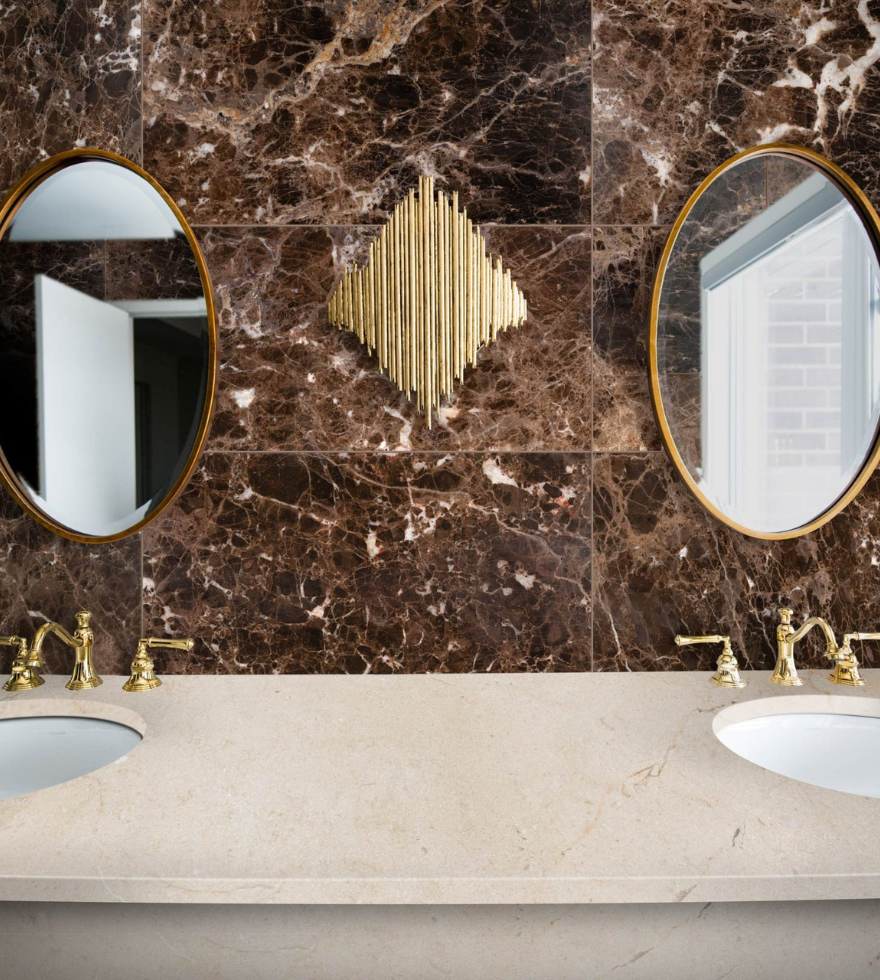 Luxurious bathroom with Dark Emperador marble wall and dual mirrors – deep brown tones with elegant white veining by Natural Stone Spain
