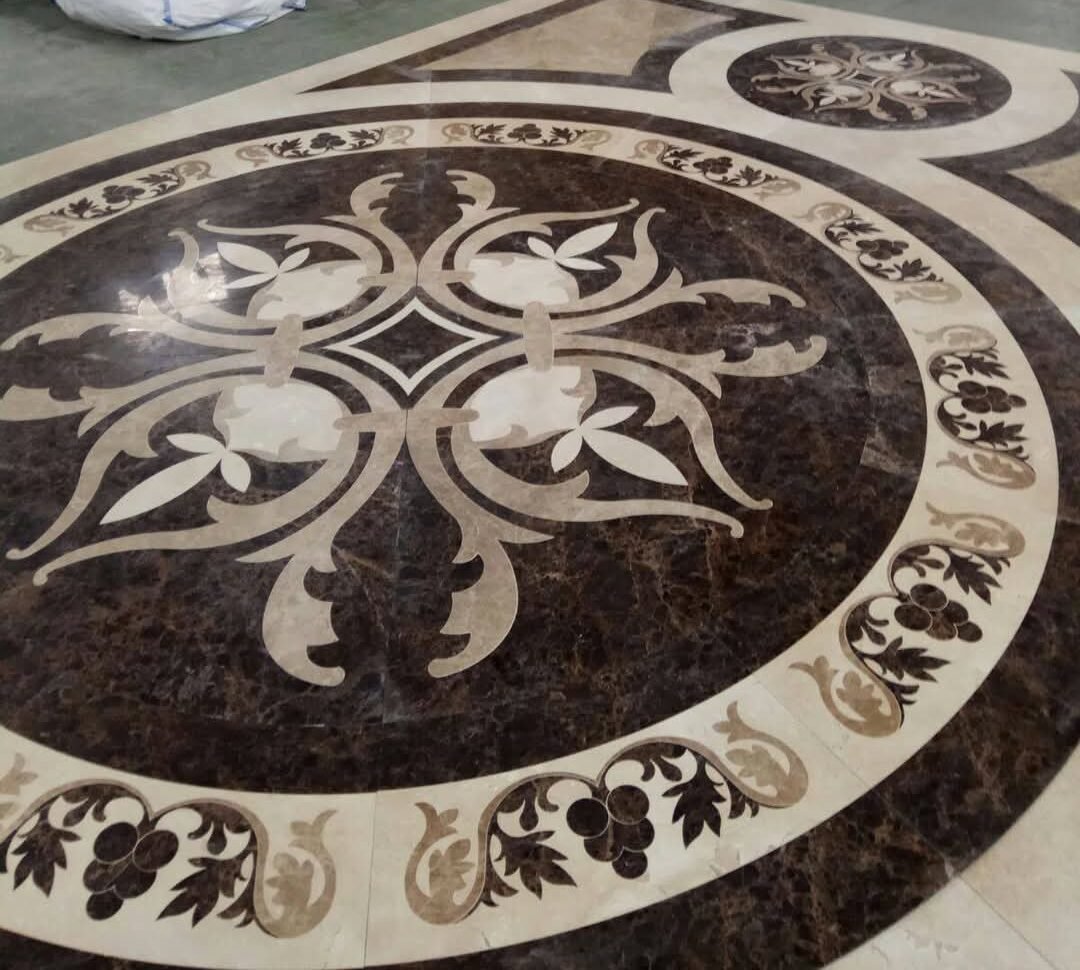 Intricately designed floor medallion crafted with Dark Emperador marble – luxurious custom inlay work by Natural Stone Spain.