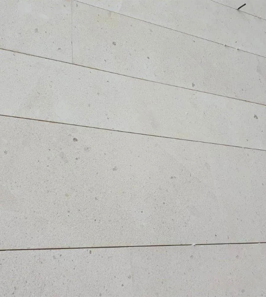 Caliza Marbella limestone wall cladding in a clean linear layout – refined and natural surface finish by Natural Stone Spain