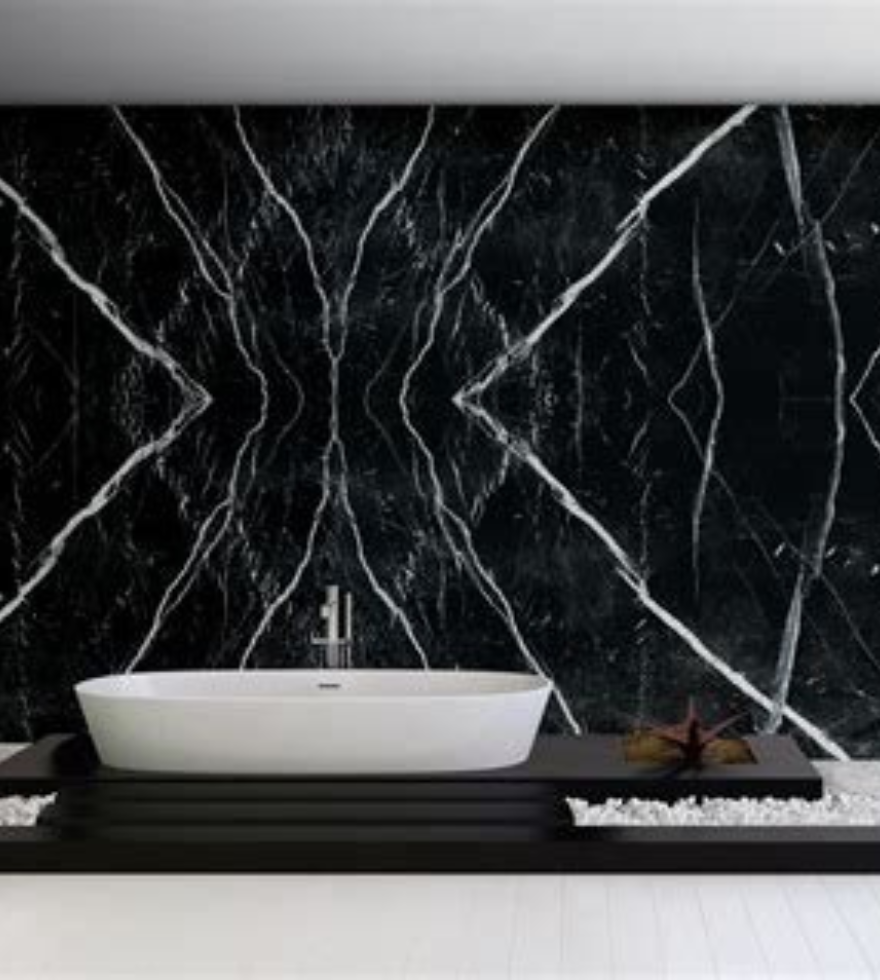 Luxurious bathroom wall cladding in bookmatched Negro Marquina marble – dramatic black stone design by Natural Stone Spain.