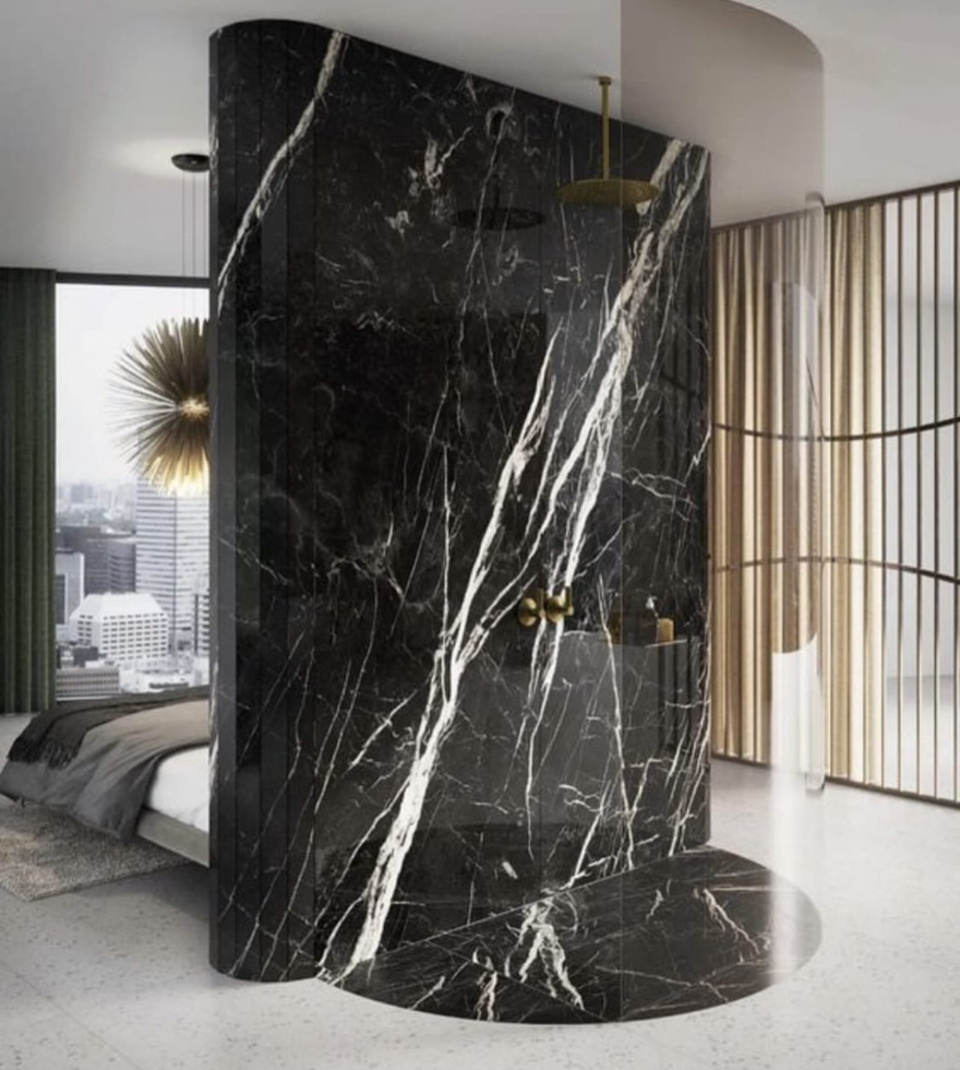 Sophisticated modern interior with a Negro Marquina marble partition wall – bold black stone with striking white veining by Natural Stone Spain.