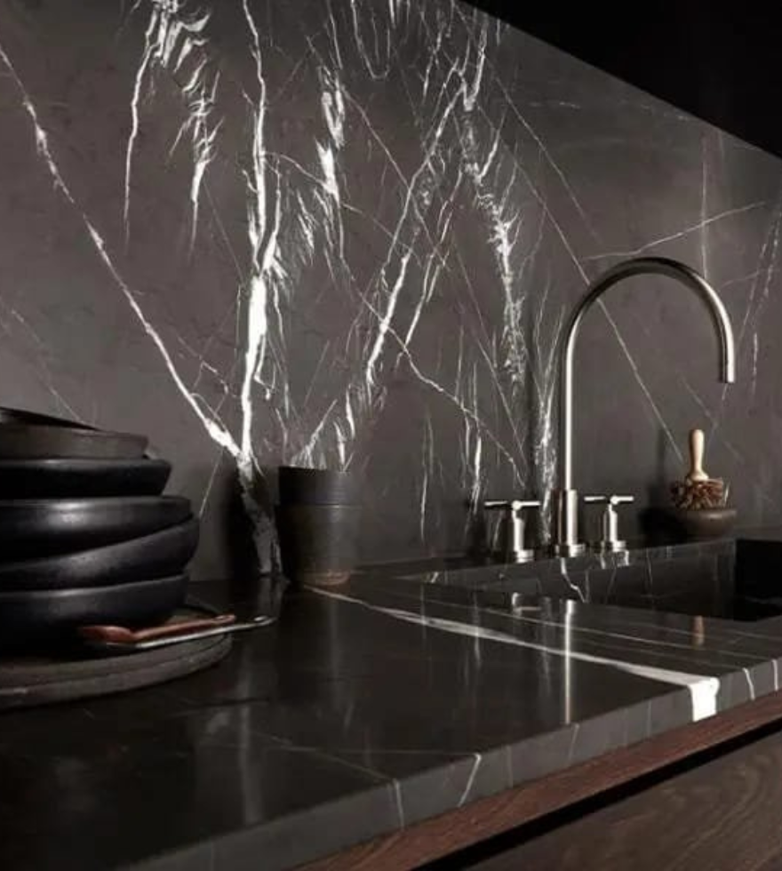 Luxury kitchen countertop and backsplash in Negro Marquina marble – dramatic black surface with white veining by Natural Stone Spain.