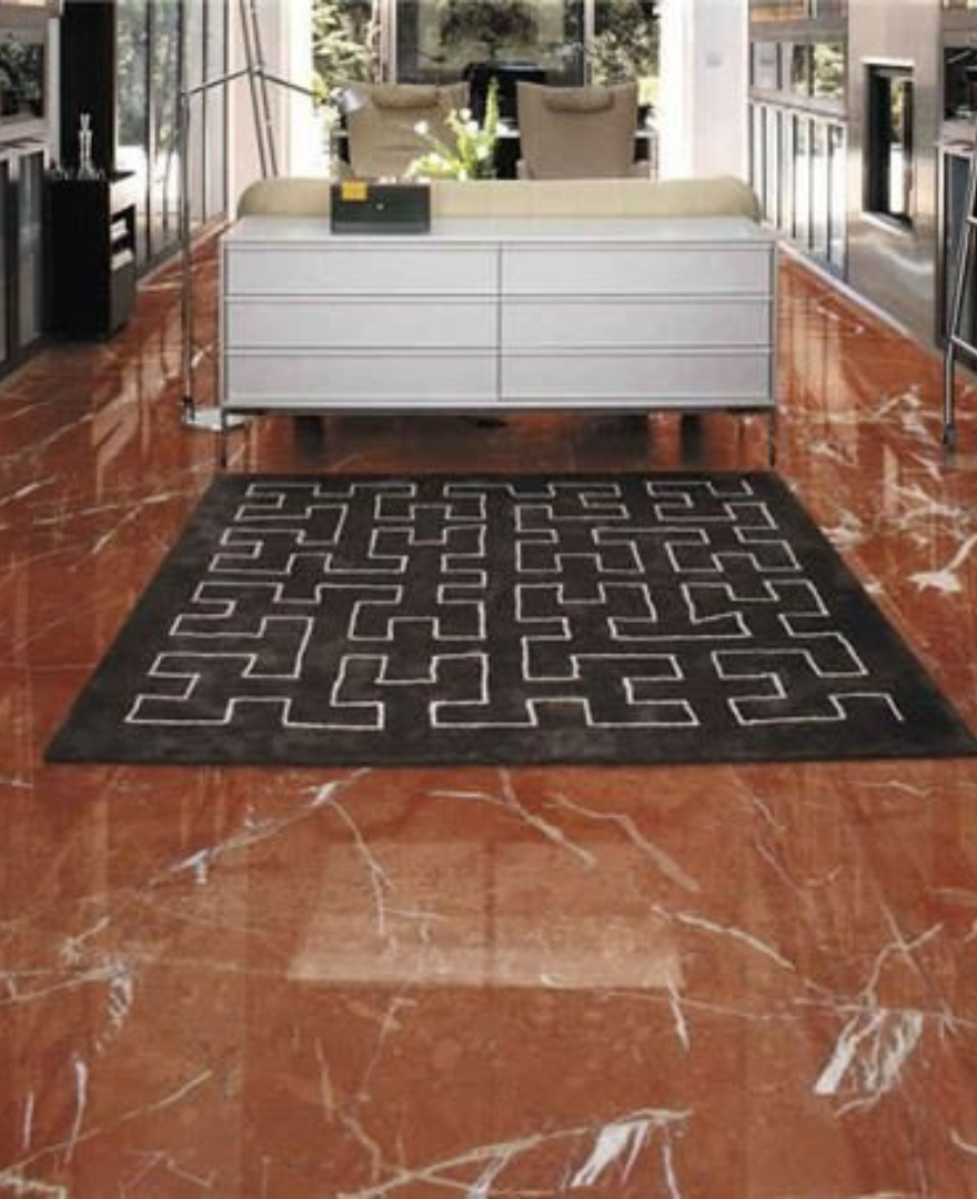 Contemporary interior with glossy Red Alicante Marble flooring – bold and elegant surface finish by Natural Stone Spain