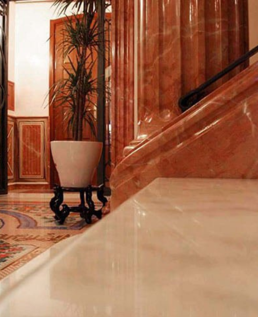 Classic interior staircase and wall cladding in Red Alicante Marble – rich red tones with elegant veining by Natural Stone Spain
