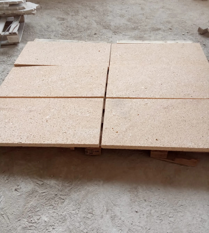 Limestone tiles neatly arranged on a pallet for shipment – high-quality natural stone ready for export by Natural Stone Spain